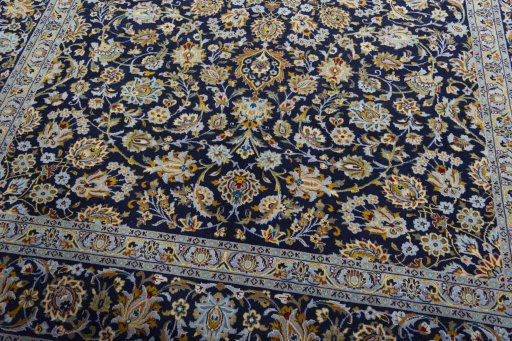 Close-up detail of 2000s Kashan rug from Iran / Persia showing Wool weave