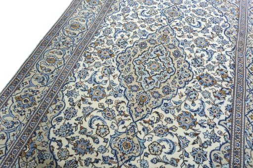 Backside of handmade 2000s Kashan rug showing knot structure and weave density