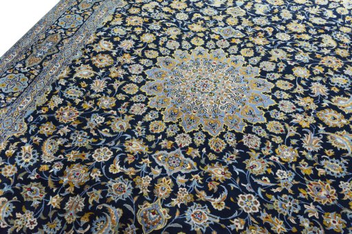 Backside of handmade 2000s Kashan rug showing knot structure and weave density
