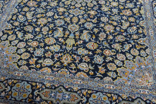 Close-up detail of 2000s Kashan rug from Iran / Persia showing Wool weave