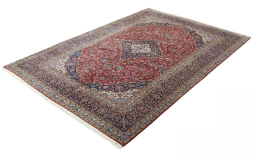 Corner detail of 2000s Kashan rug showing border pattern and Cork pile