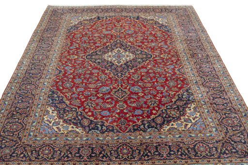 Surface texture of 2000s Kashan rug with natural Cork and intricate pattern