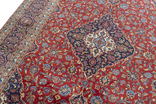 Backside of handmade 2000s Kashan rug showing knot structure and weave density