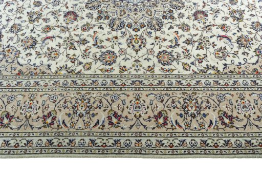 Corner detail of 2000s Kashan rug showing border pattern and Wool pile