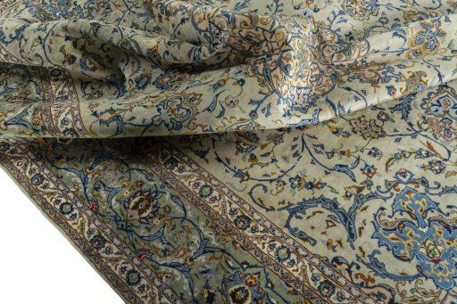 Surface texture of 2000s Kashan rug with natural Wool and intricate pattern