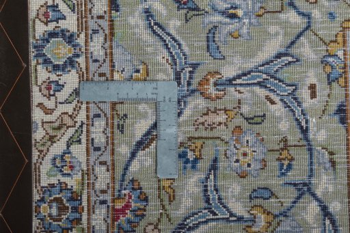 Backside of handmade 2000s Kashan rug showing knot structure and weave density