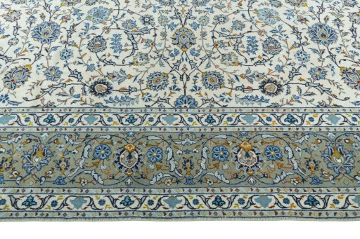 Corner detail of 2000s Kashan rug showing border pattern and Wool pile