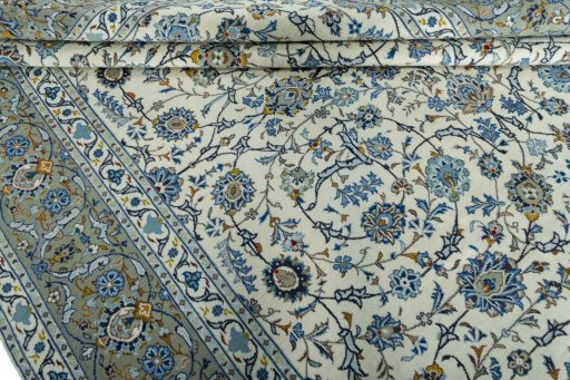 Close-up detail of 2000s Kashan rug from Iran / Persia showing Wool weave