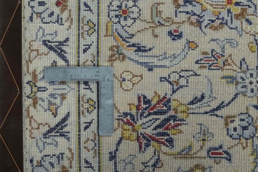 Backside of handmade 2000s Kashan rug showing knot structure and weave density