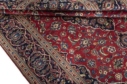 Close-up detail of 2000s Kashan rug from Iran / Persia showing Wool weave