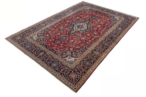 Corner detail of 2000s Kashan rug showing border pattern and Wool pile