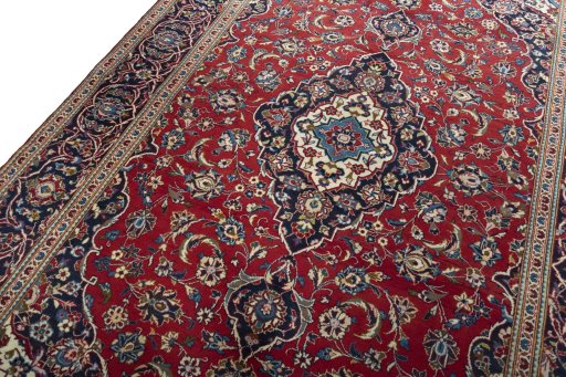 Backside of handmade 2000s Kashan rug showing knot structure and weave density