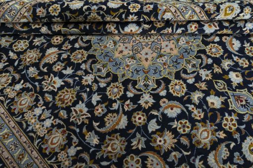Close-up detail of 2000s Kashan rug from Iran / Persia showing Wool weave