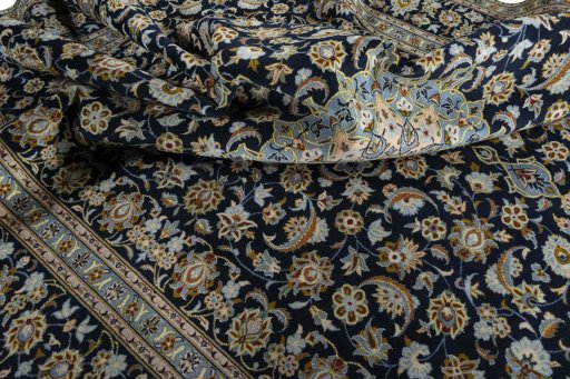 Surface texture of 2000s Kashan rug with natural Wool and intricate pattern