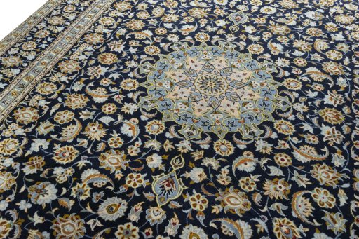 Backside of handmade 2000s Kashan rug showing knot structure and weave density