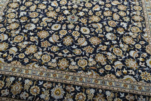 Close-up detail of 2000s Kashan rug from Iran / Persia showing Wool weave