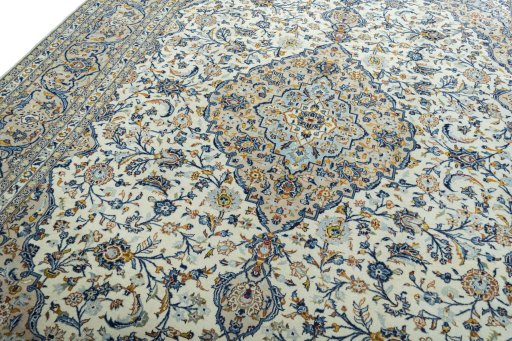 Backside of handmade 2000s Kashan rug showing knot structure and weave density