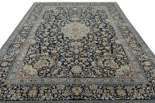 Surface texture of 2000s Kashan rug with natural Wool and intricate pattern