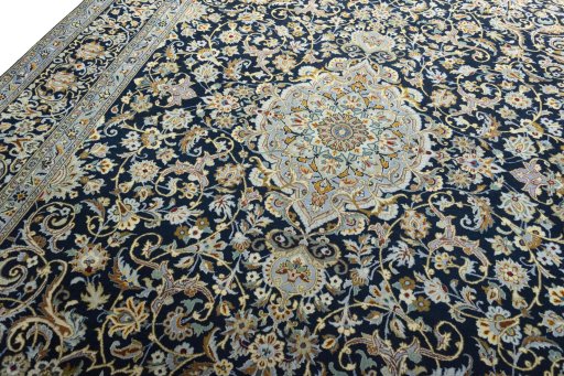 Backside of handmade 2000s Kashan rug showing knot structure and weave density