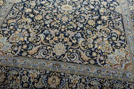 Close-up detail of 2000s Kashan rug from Iran / Persia showing Wool weave