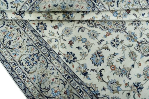 Close-up detail of 2000s Kashan rug from Iran / Persia showing Wool weave