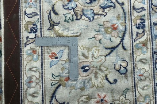 Backside of handmade 2000s Kashan rug showing knot structure and weave density