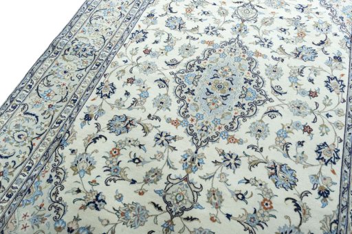 Backside of handmade 2000s Kashan rug showing knot structure and weave density