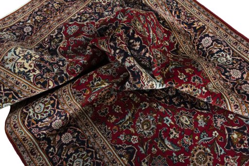 Surface texture of 2000s Kashan rug with natural Wool and intricate pattern