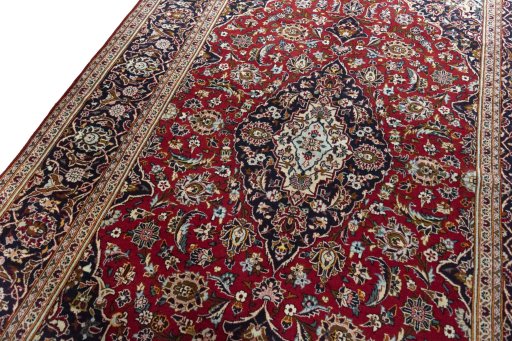 Backside of handmade 2000s Kashan rug showing knot structure and weave density