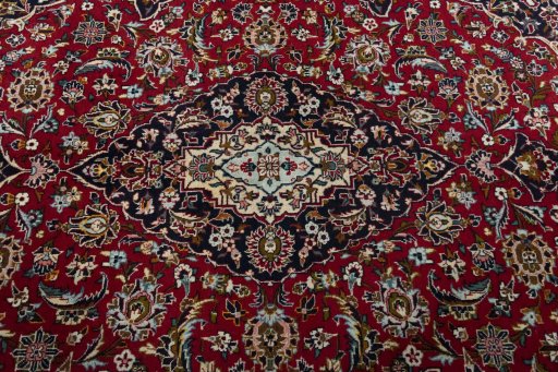 Central medallion detail of 2000s Kashan rug from Iran / Persia