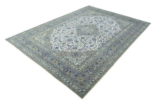 Corner detail of 2000s Kashan rug showing border pattern and Cork pile