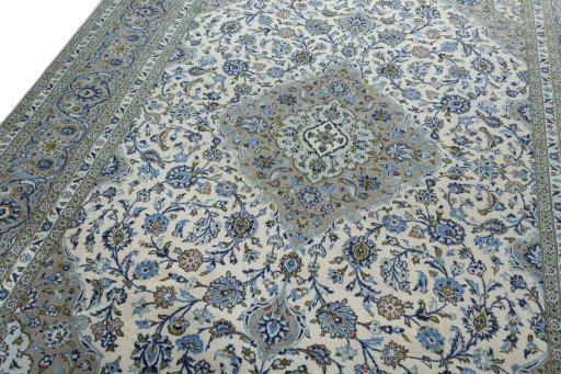 Backside of handmade 2000s Kashan rug showing knot structure and weave density