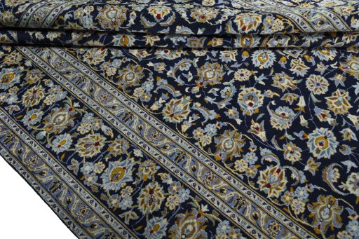 Close-up detail of 2000s Kashan rug from Iran / Persia showing Wool weave