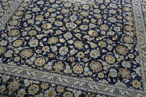 Close-up detail of 2000s Kashan rug from Iran / Persia showing Wool weave
