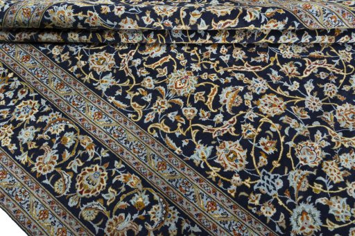 Close-up detail of 2000s Kashan rug from Iran / Persia showing Wool weave