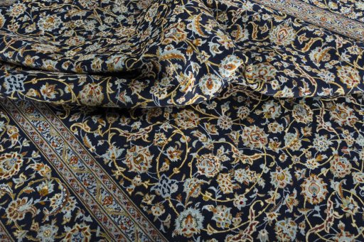 Surface texture of 2000s Kashan rug with natural Wool and intricate pattern