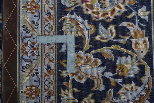 Backside of handmade 2000s Kashan rug showing knot structure and weave density