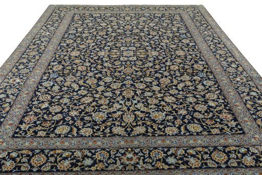 Surface texture of 2000s Kashan rug with natural Wool and intricate pattern