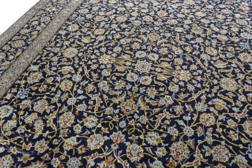 Backside of handmade 2000s Kashan rug showing knot structure and weave density
