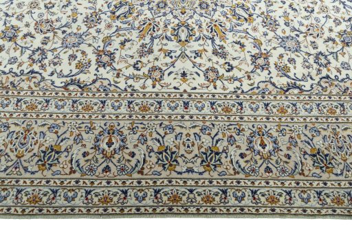 Corner detail of 2000s Kashan rug showing border pattern and Wool pile