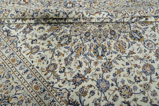 Close-up detail of 2000s Kashan rug from Iran / Persia showing Wool weave