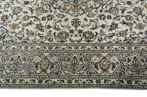 Corner detail of 2000s Kashan rug showing border pattern and Wool pile