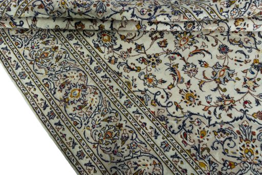 Close-up detail of 2000s Kashan rug from Iran / Persia showing Wool weave