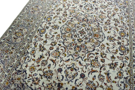 Backside of handmade 2000s Kashan rug showing knot structure and weave density