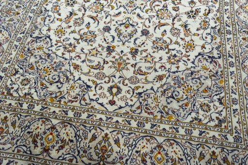 Close-up detail of 2000s Kashan rug from Iran / Persia showing Wool weave