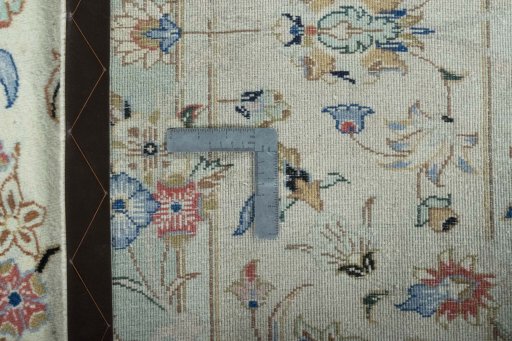 Backside of handmade New Kashan rug showing knot structure and weave density