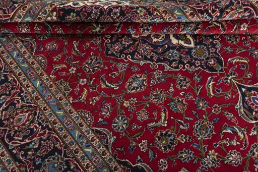 Close-up detail of 2000s Kashan rug from Iran / Persia showing Wool weave