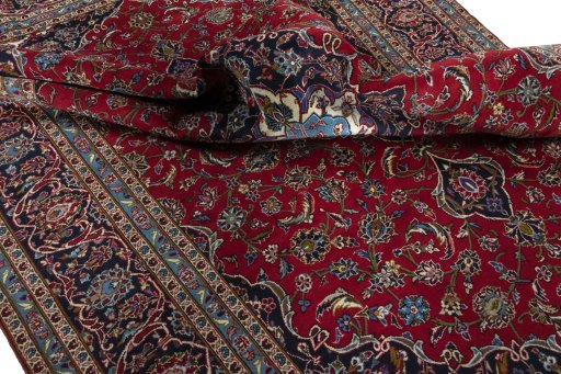 Surface texture of 2000s Kashan rug with natural Wool and intricate pattern