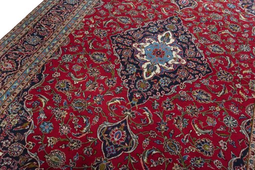 Backside of handmade 2000s Kashan rug showing knot structure and weave density