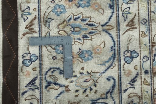 Backside of handmade 2000s Kashan rug showing knot structure and weave density